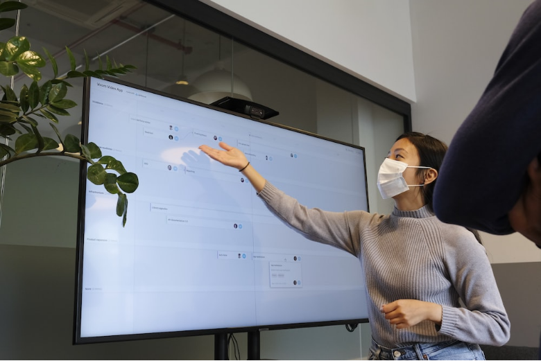 Teacher using a digital whiteboard to make class engaging 